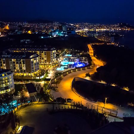 Ramada Resort Kusadasi & Golf Exterior photo Aerial view of the resort at night