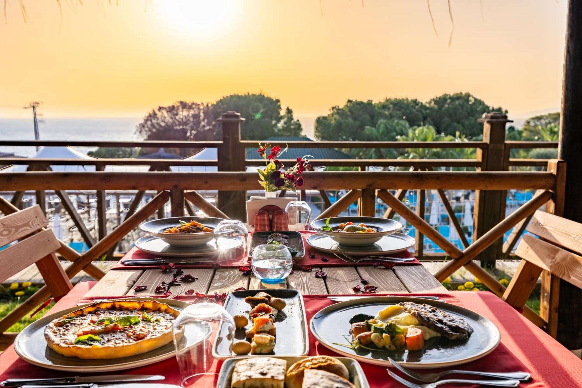 Ramada Resort Kusadasi & Golf Exterior photo A typical dinner at the resort