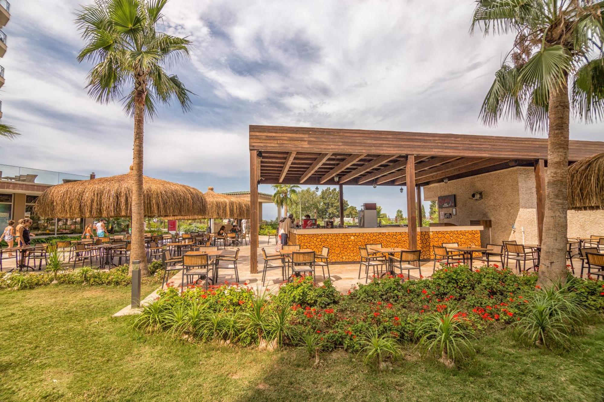 Ramada Resort Kusadasi & Golf Exterior photo The beach bar at the resort