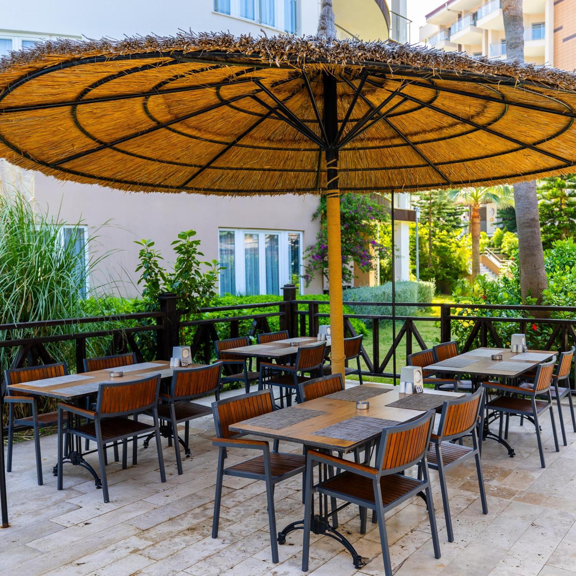 Ramada Resort Kusadasi & Golf Exterior photo A restaurant in Turkey